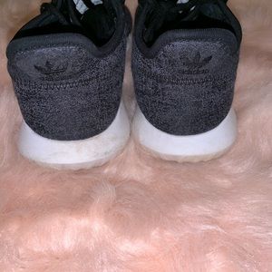 black adidas tennis shoe